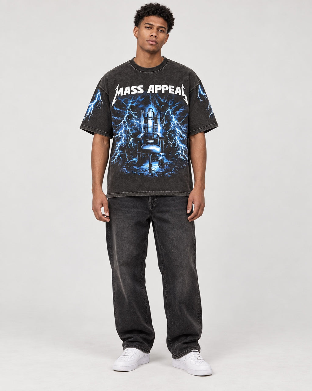 Model wearing the Mass Appeal Electric Throne oversized black graphic T-shirt